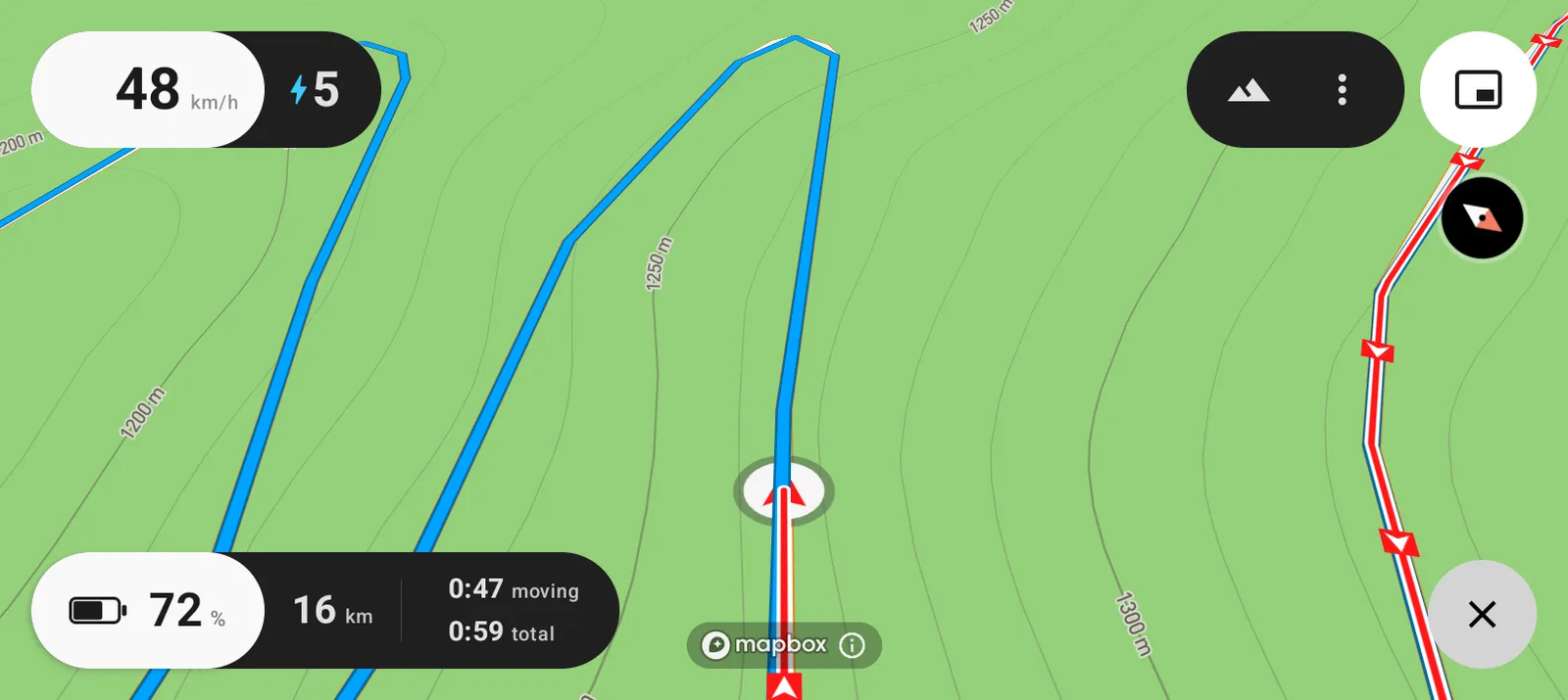 A red trail with a white outline, running beside the blue route